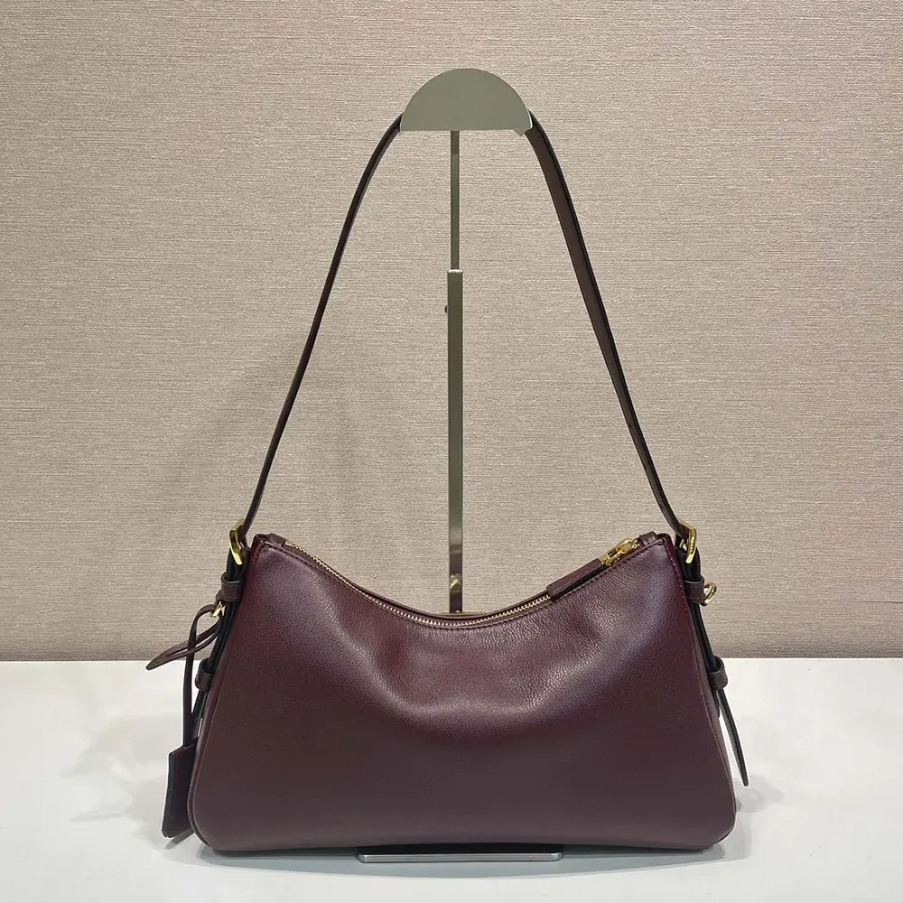 Side profile showing silhouette of Prada Women Aimée Medium Leather Bag-Maroon