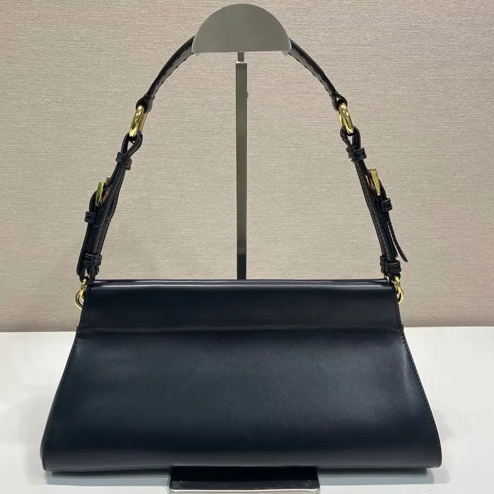 Side angle of Prada Women Enchaîné Medium Leather Bag-Black highlighting silhouette and hardware