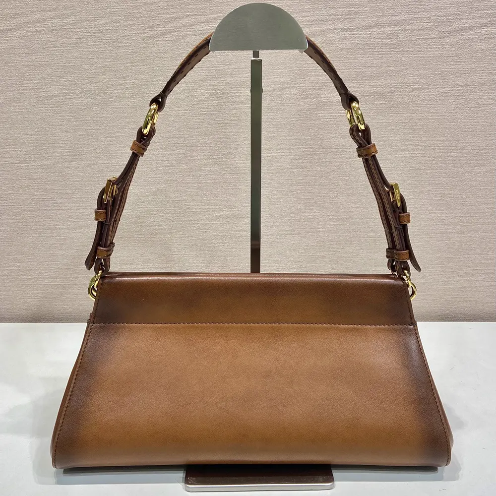 Side angle showing smooth brown leather texture of Prada Women Enchaîné Medium Leather Bag-Brown