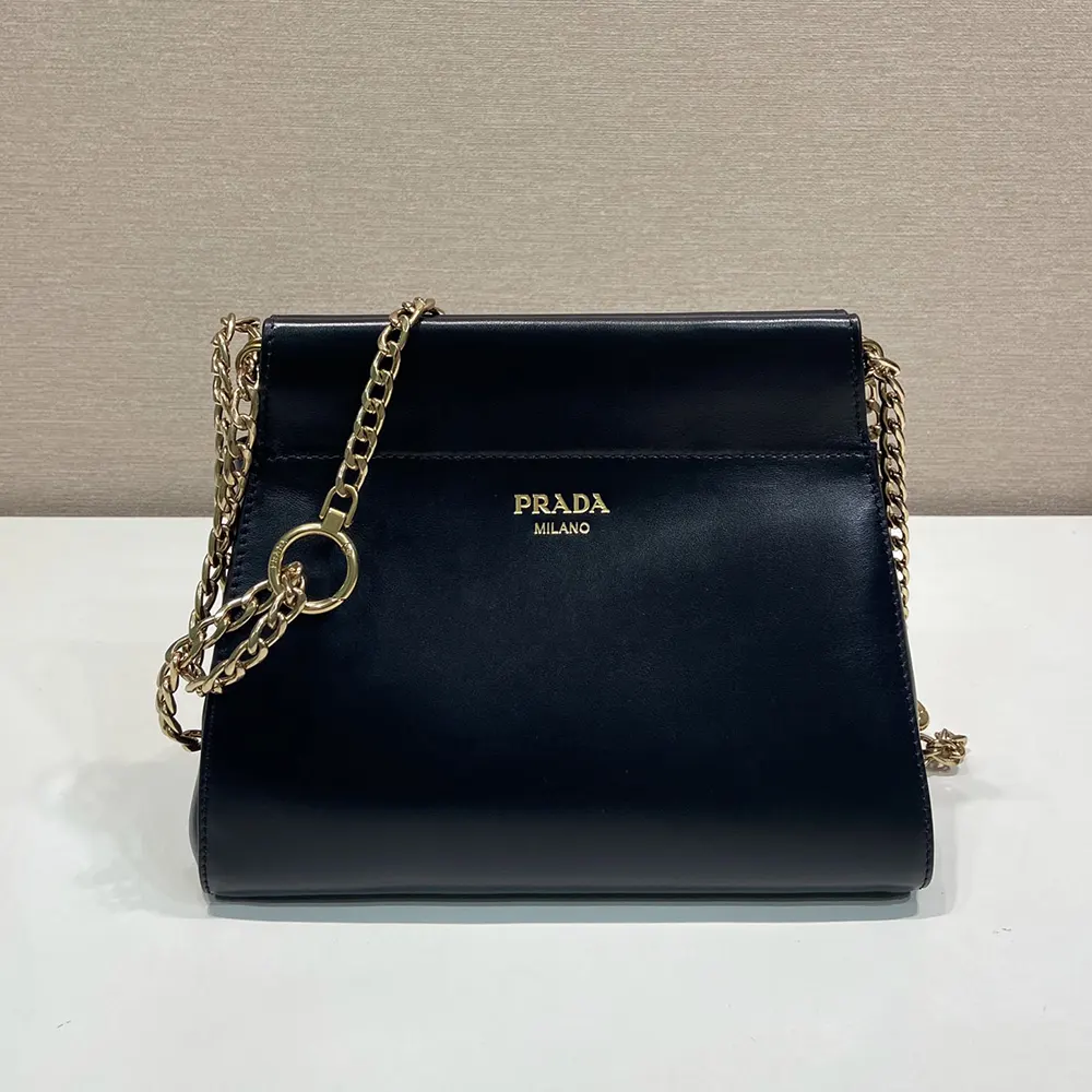 Side profile showing silhouette of Prada Women Enchaîné Mini Leather Bag-Black