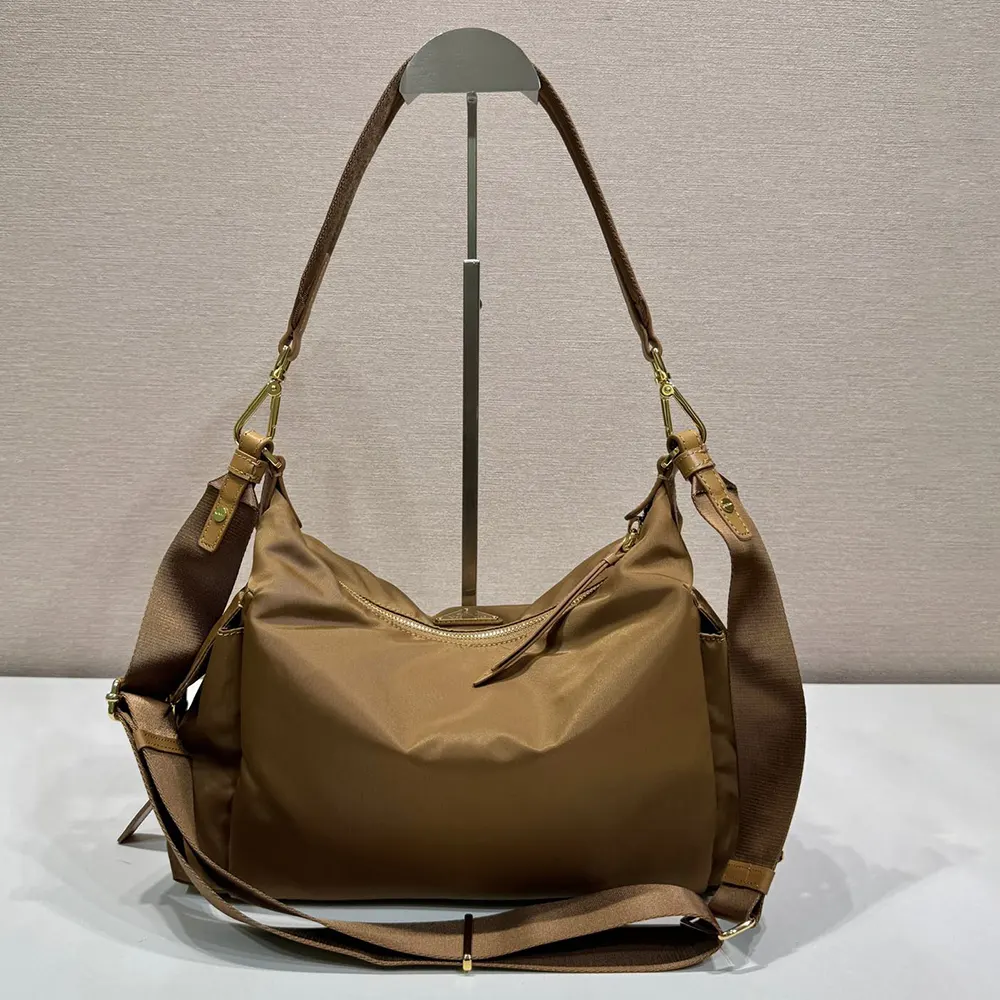 Side angle showing structure of Prada Women Explore Large Re-Nylon Shoulder Bag