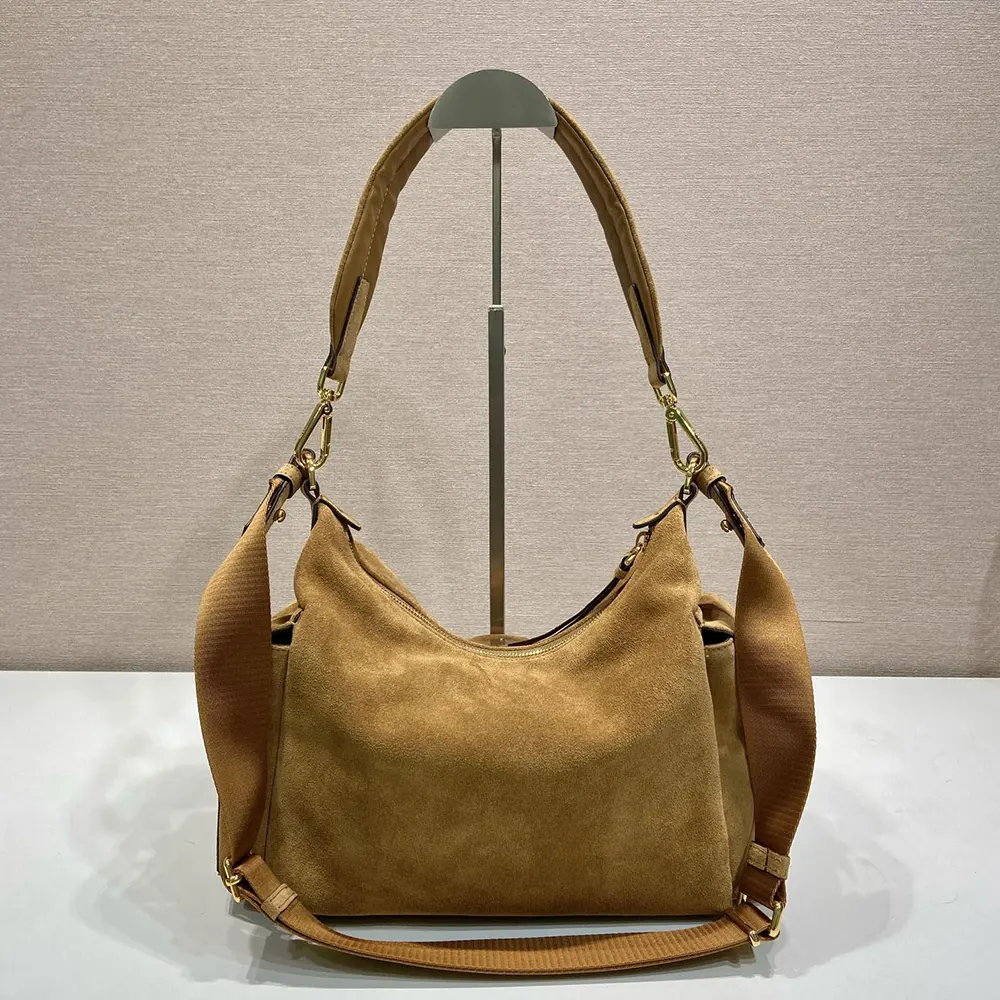 Side angle showing spacious interior of Prada Women Explore Large Suede Bag-Brown