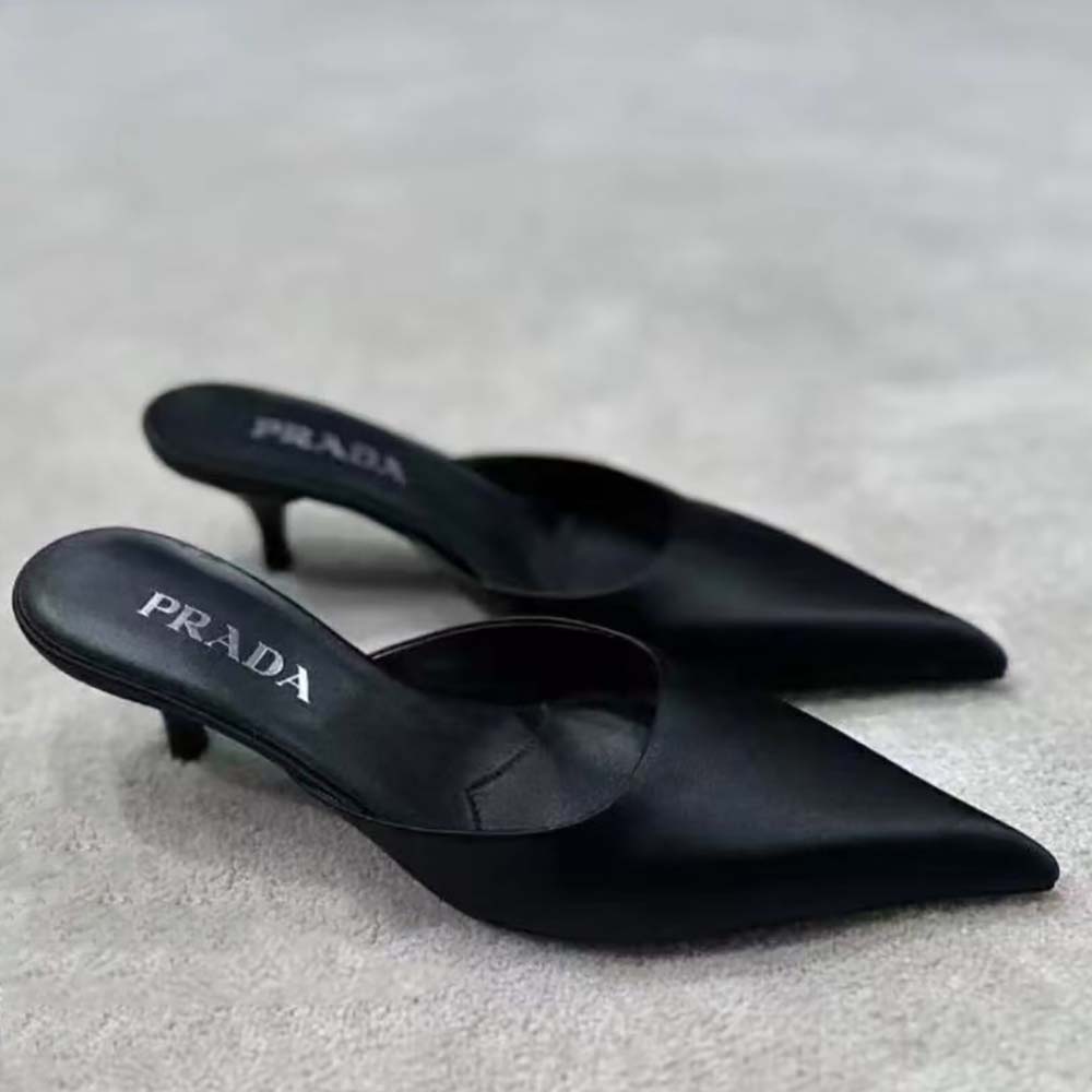 Close-up of black satin and high heel on Prada Women Mules De Satén-Black