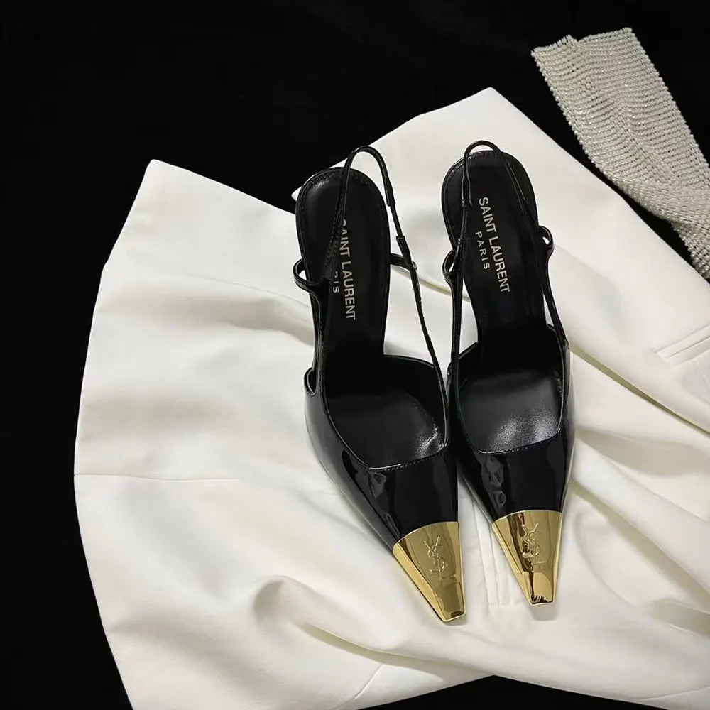 Close-up on gold YSL logo detail of Jeanne Slingback Pumps black leather