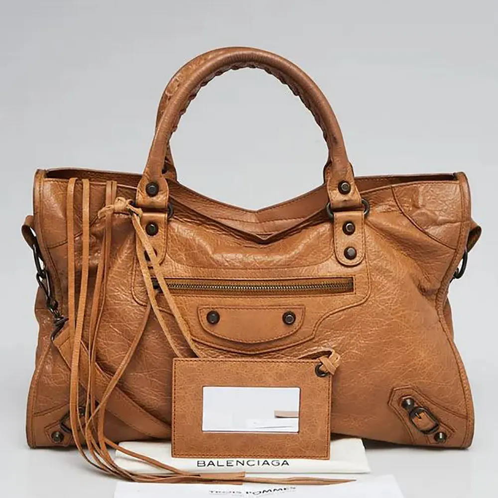Side angle showing flap closure on Balenciaga Women Le City Medium Bag Metallized
