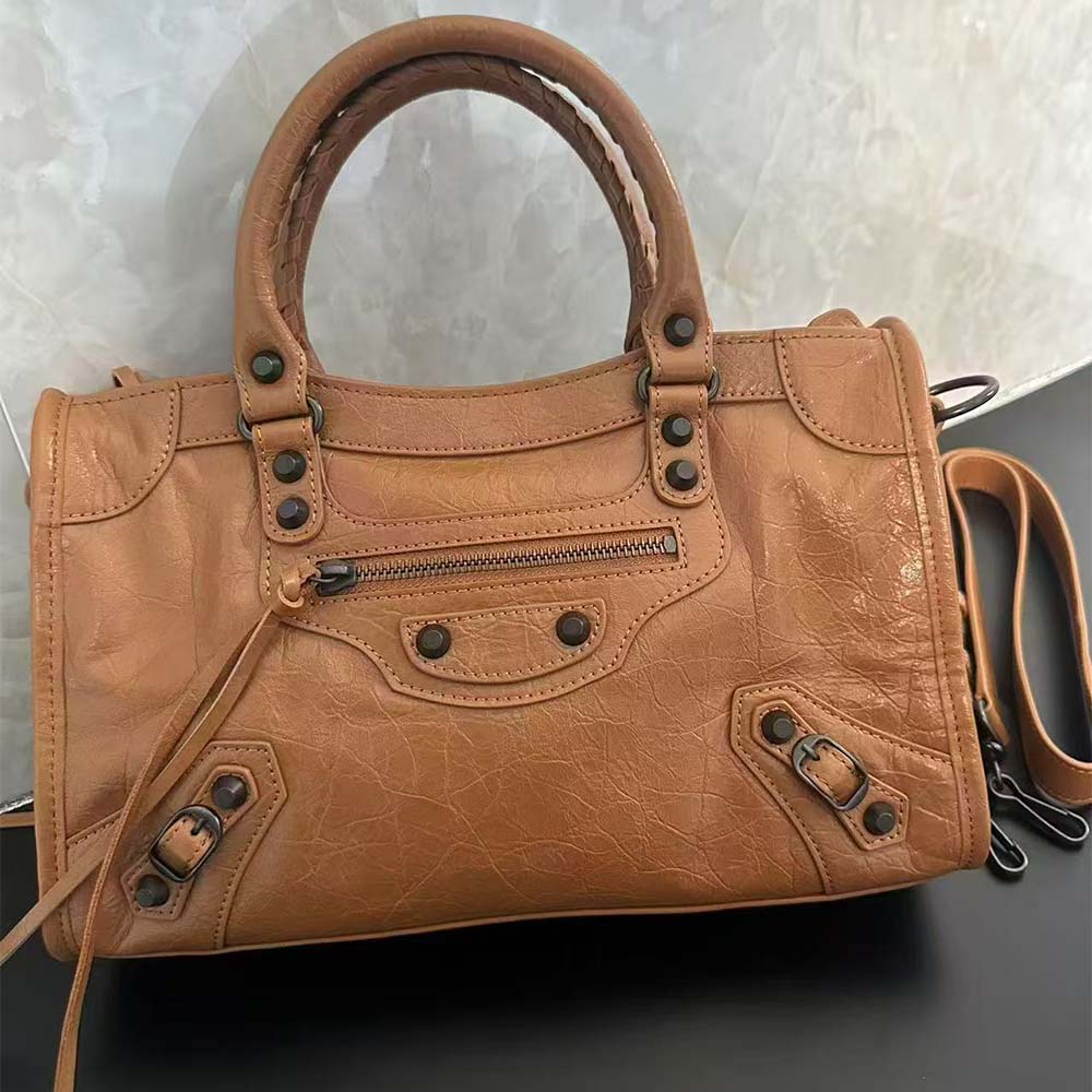 Side angle of compact silhouette on Balenciaga Women Le City Small Bag
