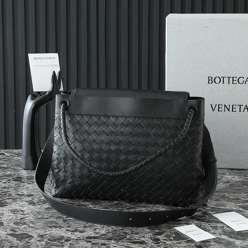 Side angle showing adjustable shoulder strap of Bottega Veneta Andiamo Messenger