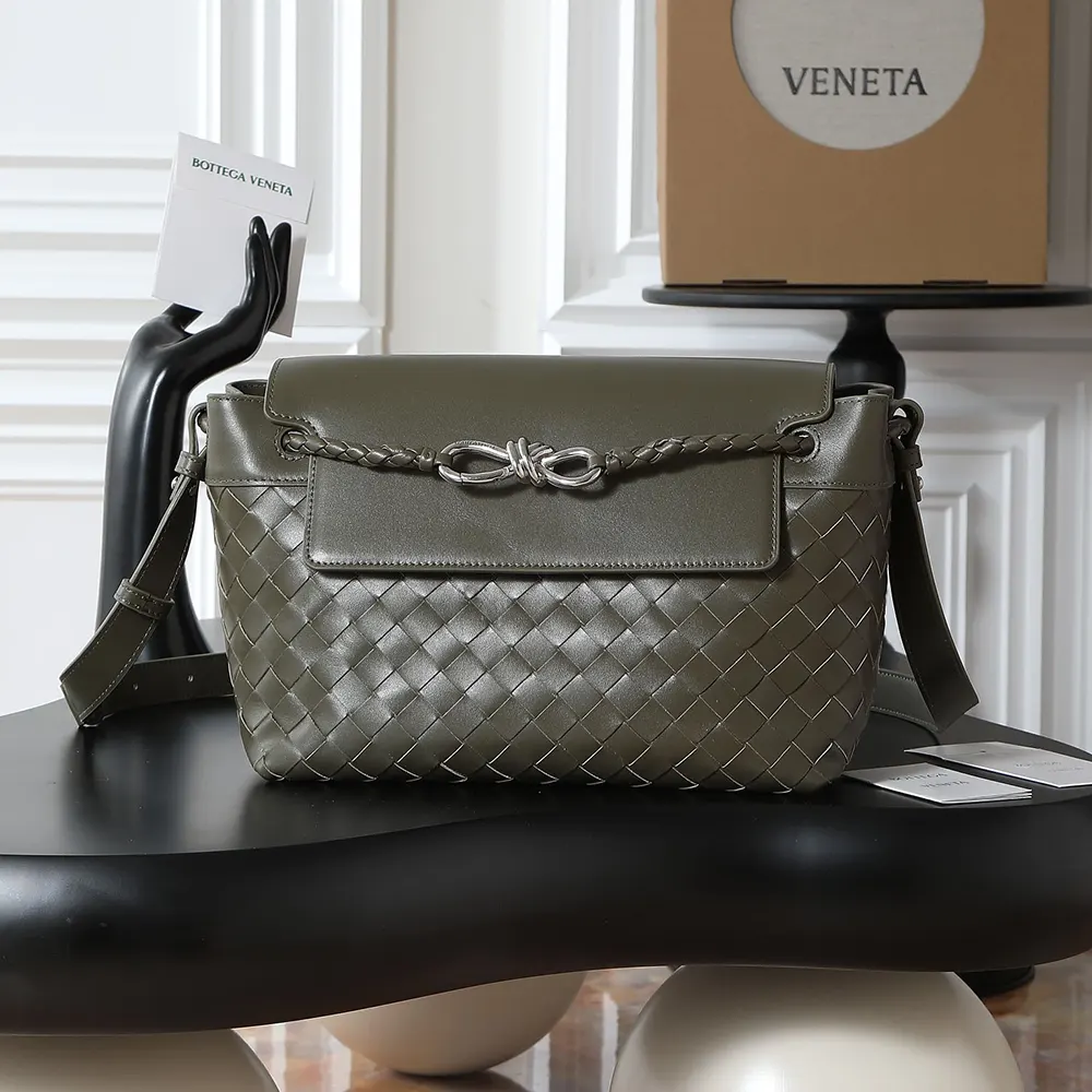 Close-up of intrecciato leather weave on messenger bag in dark green
