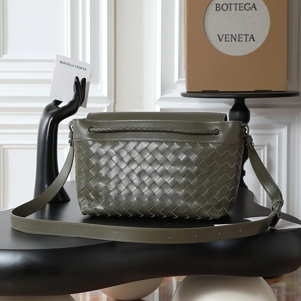 Side angle showing adjustable strap and magnetic closure of messenger bag