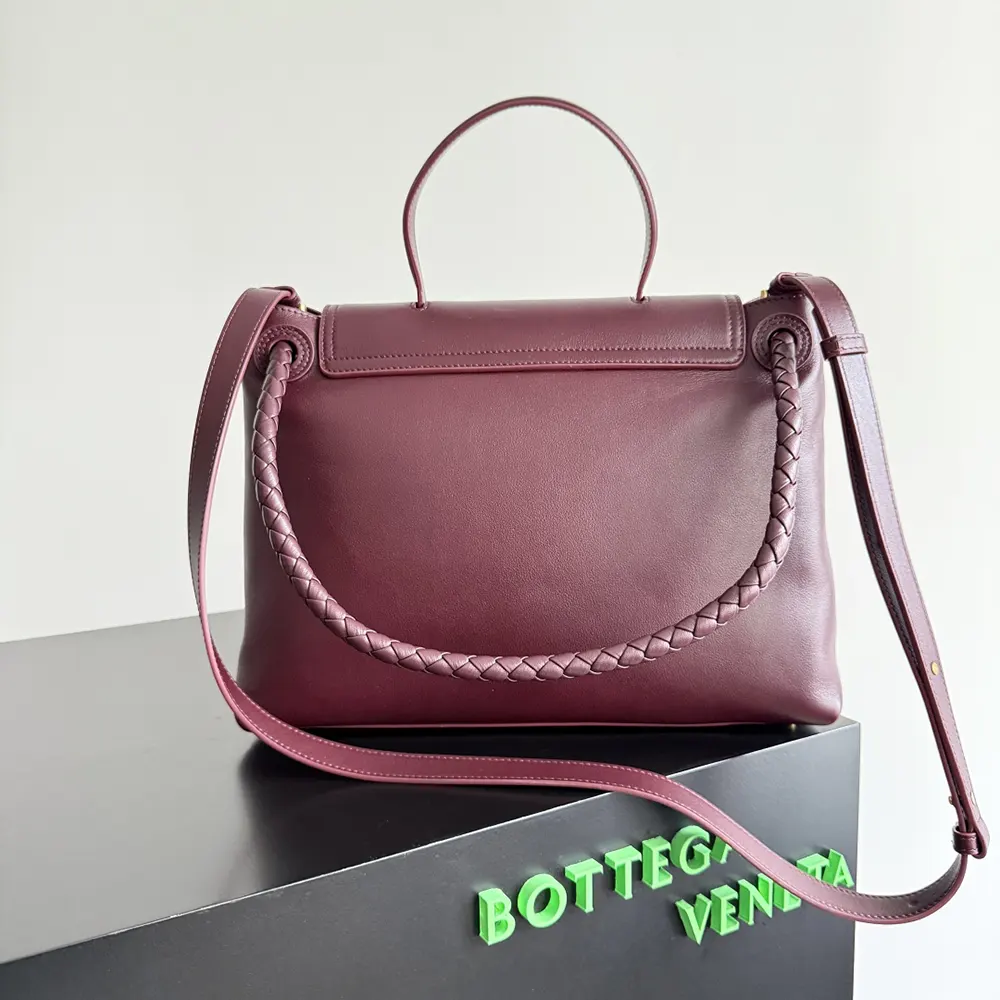 Gold-tone hardware and flap closure on Bottega Veneta Medium Campana-Barolo