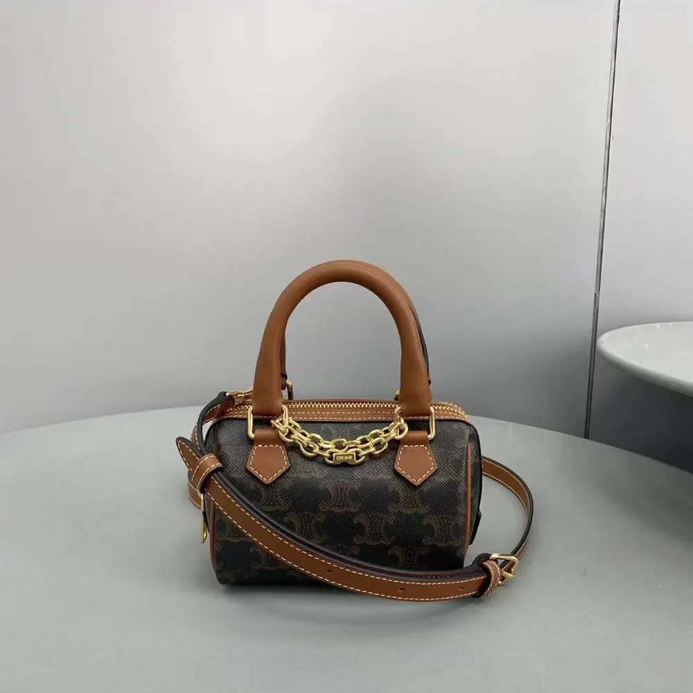 Side profile showing strap and texture of Celine Women Mini Boston Tan bag