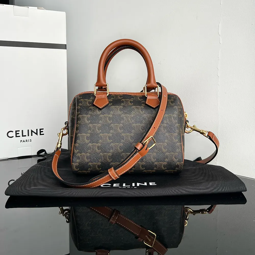 Close-up of gold-tone hardware on Celine Small Boston bag in tan calfskin