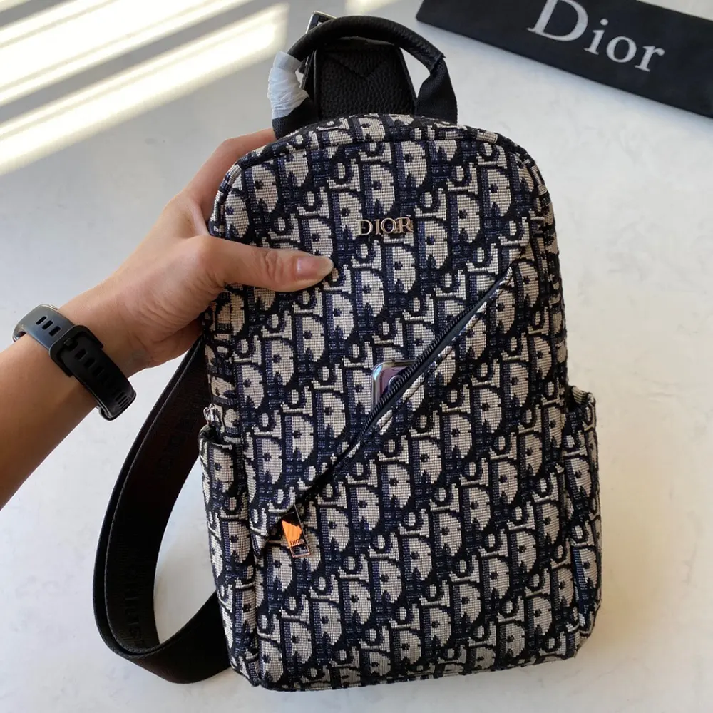 Side view showing adjustable strap on Dior Men Sling Bag Black and Beige Dior Oblique Jacquard
