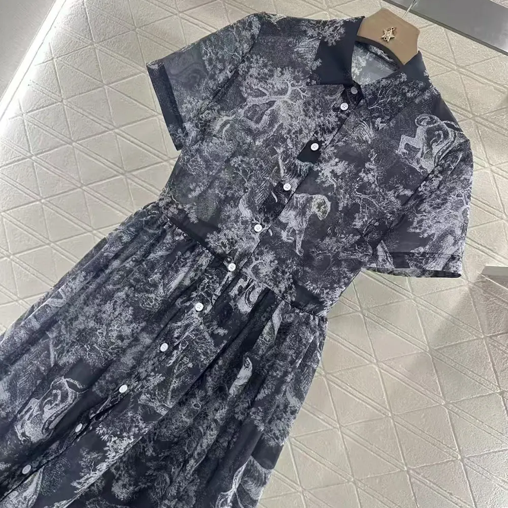 Close-up on signature Dior engraved buttons on Dioriviera shirt dress