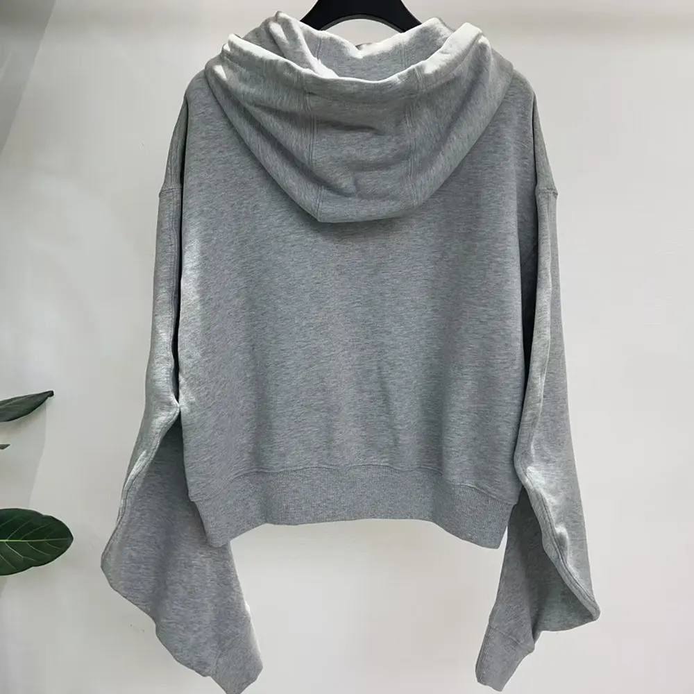 Side profile showing relaxed silhouette of Loewe Women Flamenco Hoodie