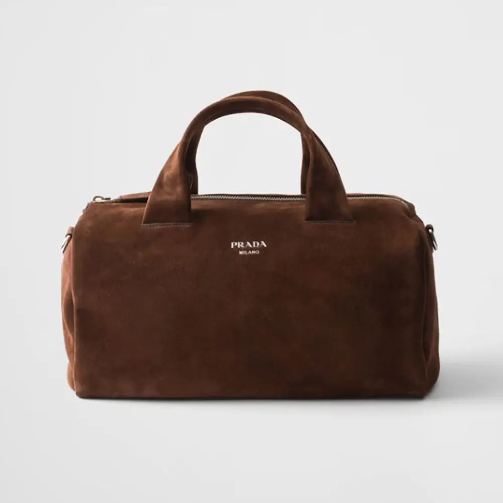 Front angle of Prada Unisex Small Suede Duffle Bag-Coffee showing suede texture