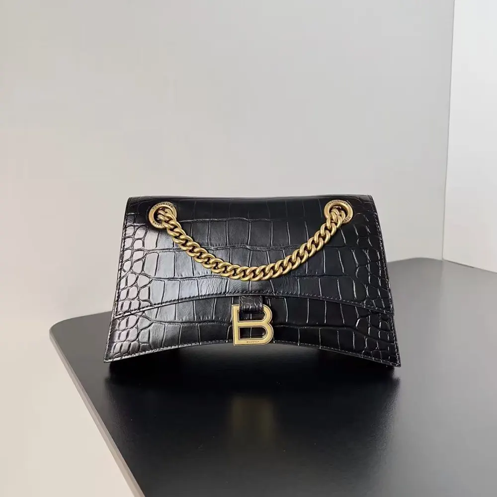 Close-up on silver-tone hardware and crocodile embossing on Balenciaga Small Crush Bag