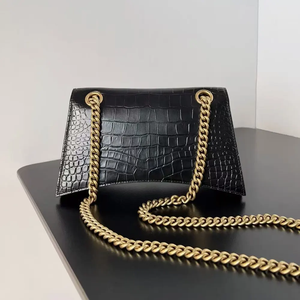 Side angle showing compact silhouette of Balenciaga Women Small Crush Shoulder Bag