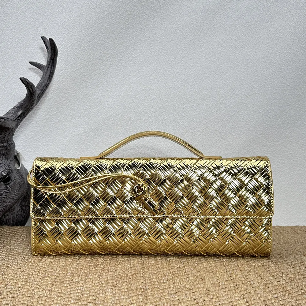 Close-up of gold-tone hardware and woven leather detail on clutch