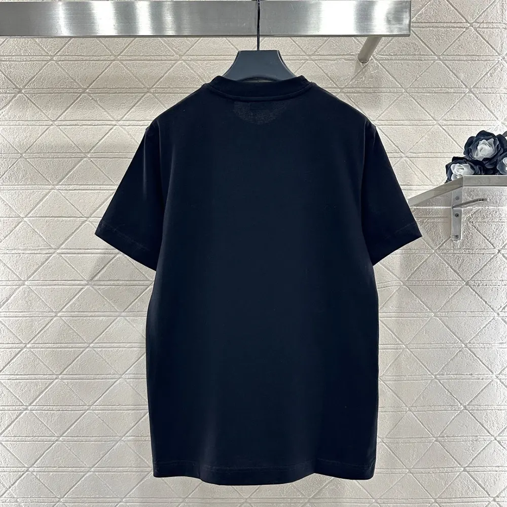 Side angle of Burberry Men EKD Check Cotton T-shirt-Black highlighting fit