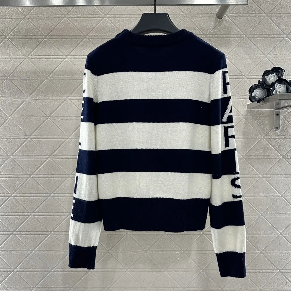 Side profile showing relaxed fit of Celine Women Crewneck Sweater black