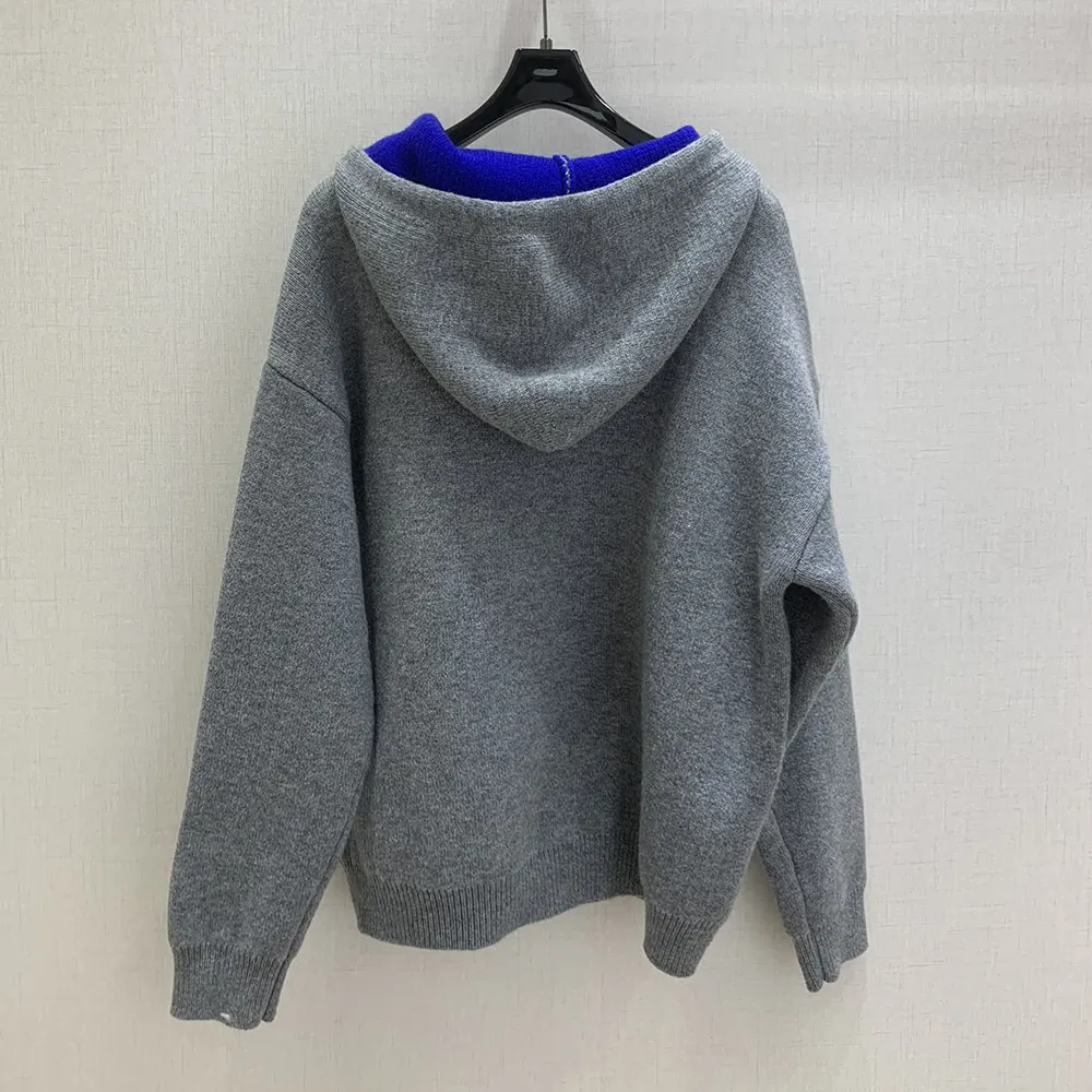 Side angle showing relaxed fit of Celine Women Hooded Sweater in Cashmere