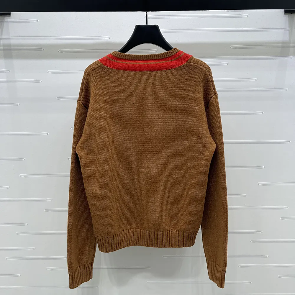Detail of V-neck and embroidered logo on Celine Men V-Neck Sweater in Cashmere-Brown