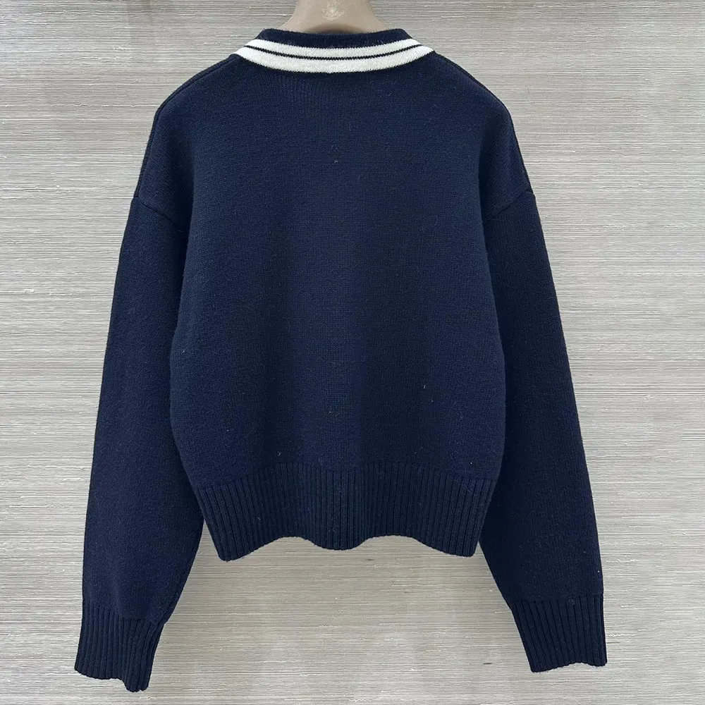 Side angle showing tailored silhouette of Celine Women V-Neck Sweater