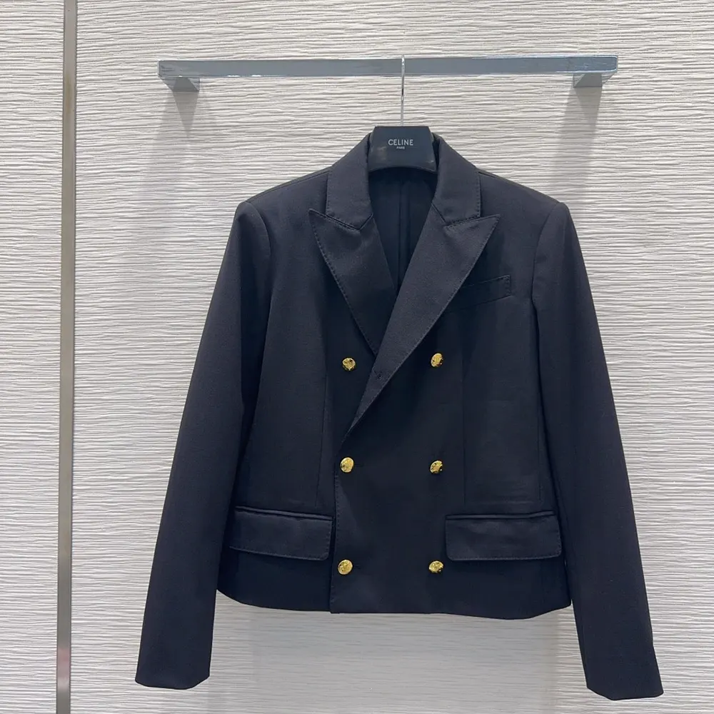 Close-up of wool gabardine texture and minimalist metal detail on Celine blazer