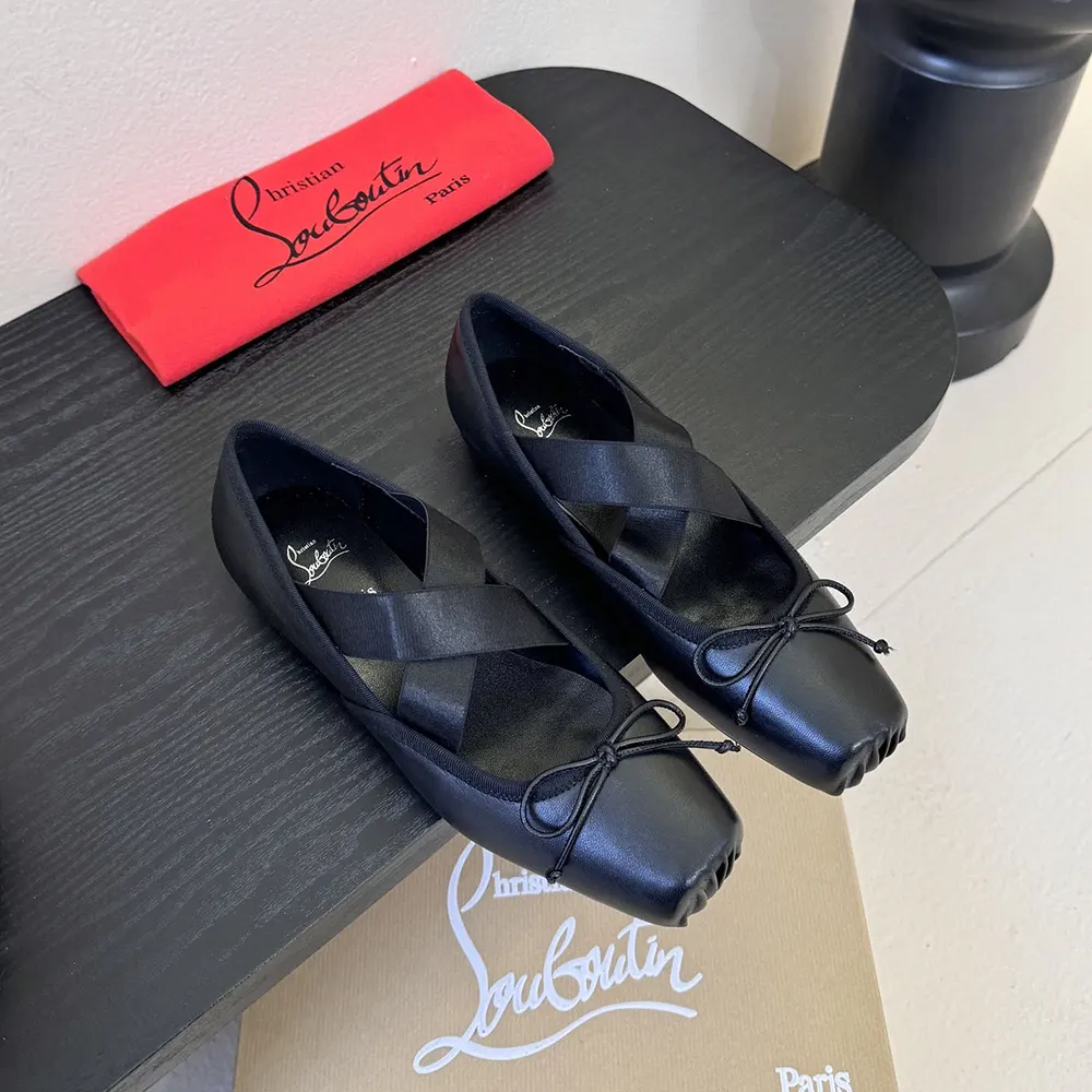 Close-up of black lamb nappa leather texture on Christian Louboutin Cassiasticina Ballerinas