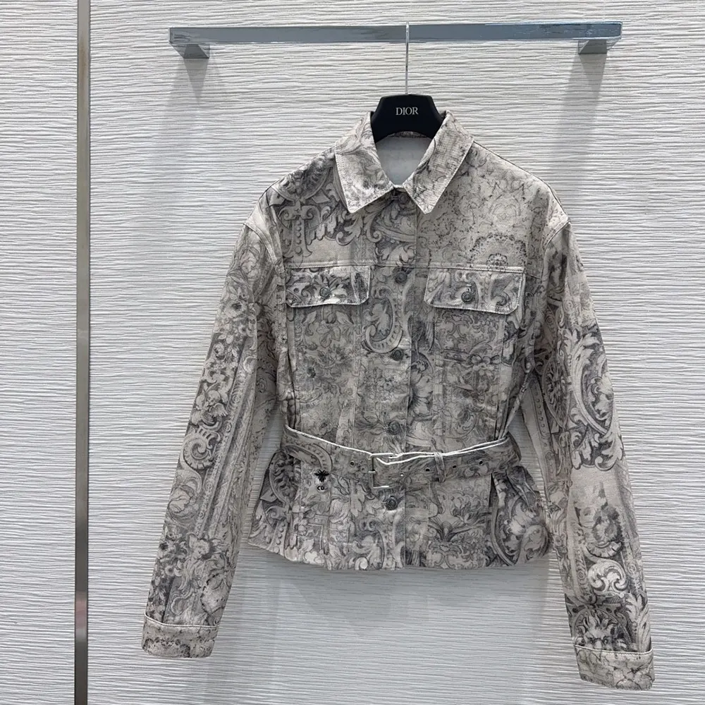 Close-up of Dior Barocco print and belt detail on women's jacket