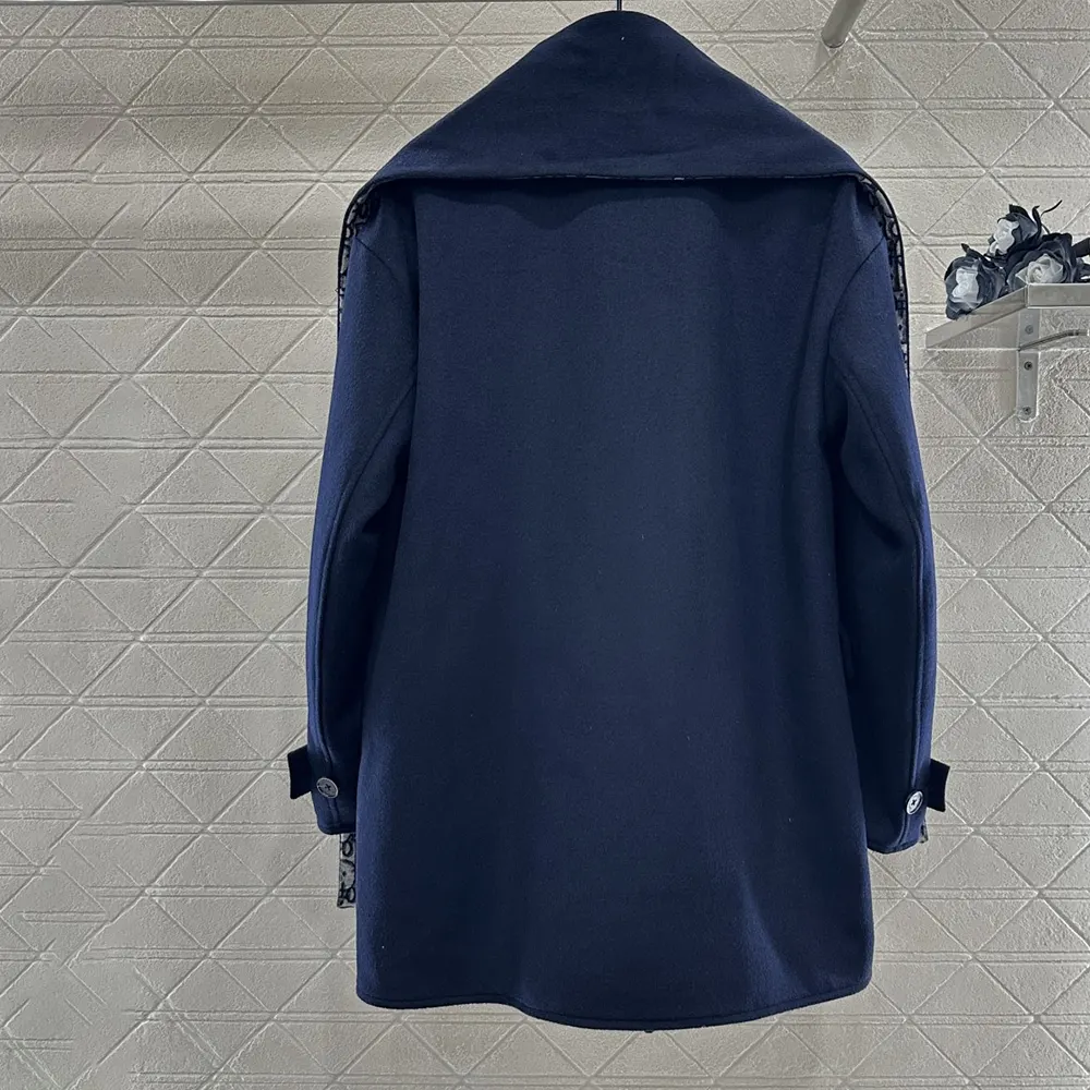 Side angle showcasing tailored silhouette of Dior Women Coat with scarf collar