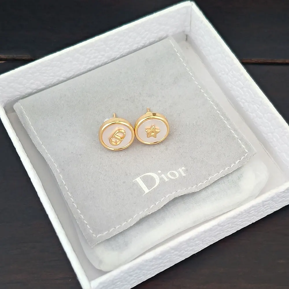 Side angle showing push-back closure of Dior Women D-Luck Stud Earrings