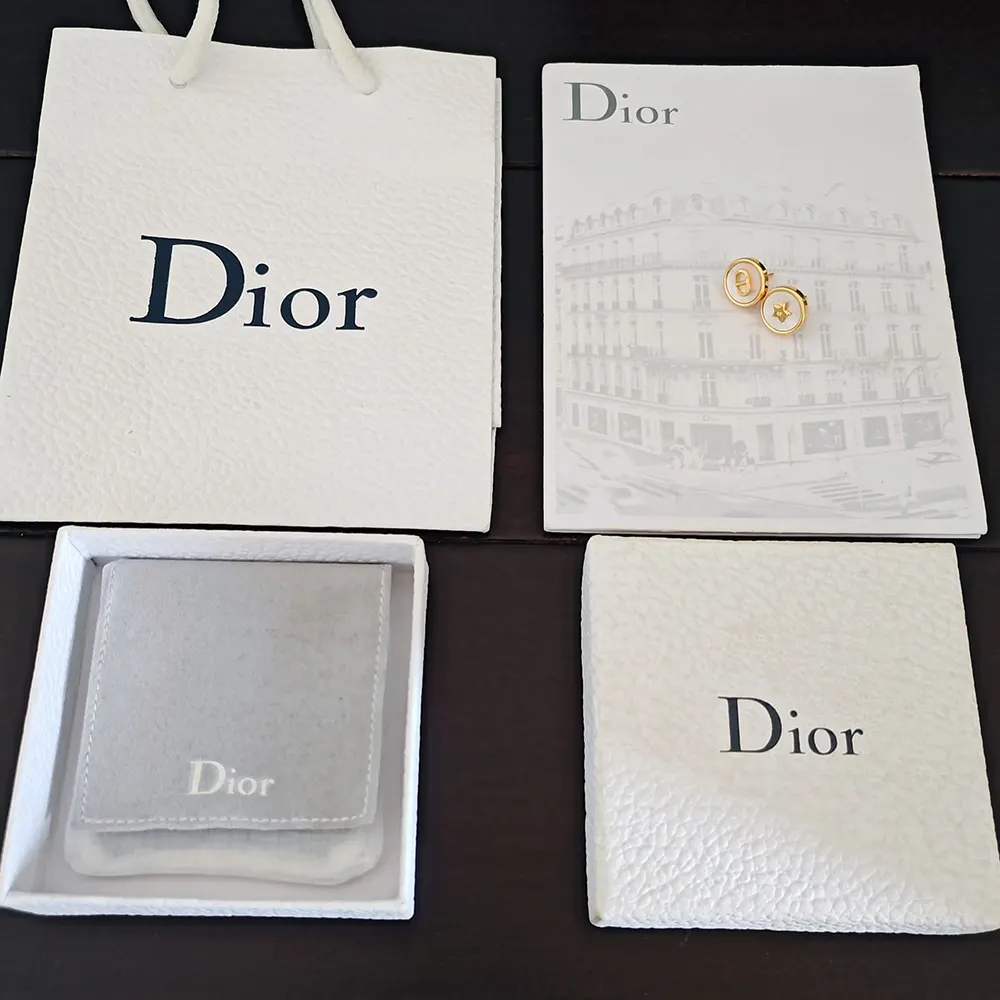 Close-up on white mother-of-pearl detail Dior Women D-Luck Stud Earrings
