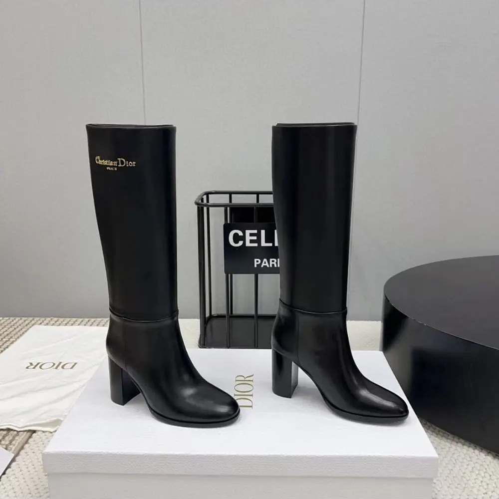 Close-up of supple calfskin and embossed Dior hardware on boot
