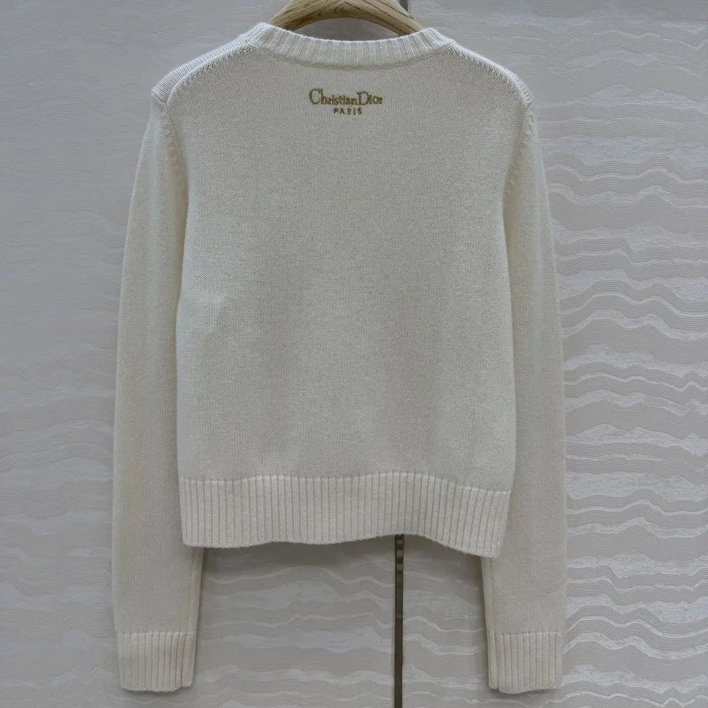 Side angle showing relaxed fit of Dior Women Embroidered Sweater Ecru