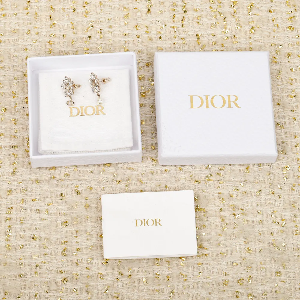 Close-up detail of white resin pearl on Dior Women Fleur de Glace Earrings