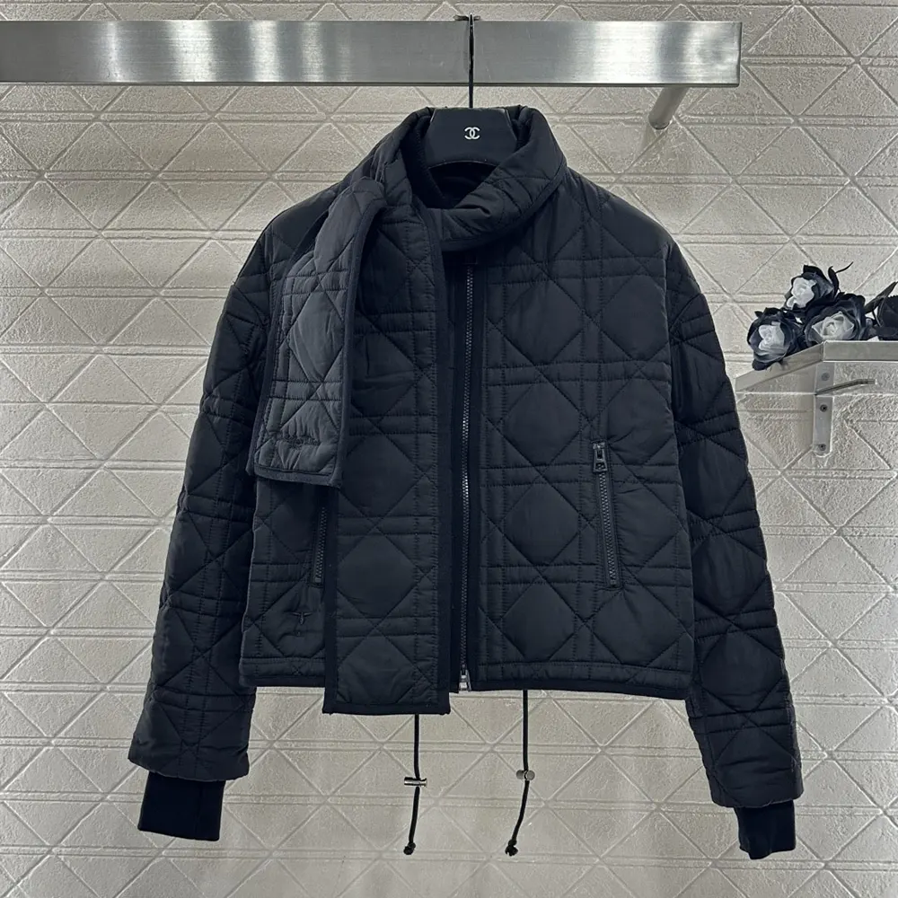 Close-up of black quilted technical taffeta on Dior coat