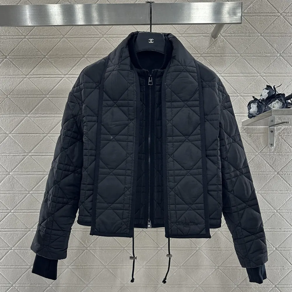 Side angle showing relaxed silhouette of Dior Macrocannage Coat