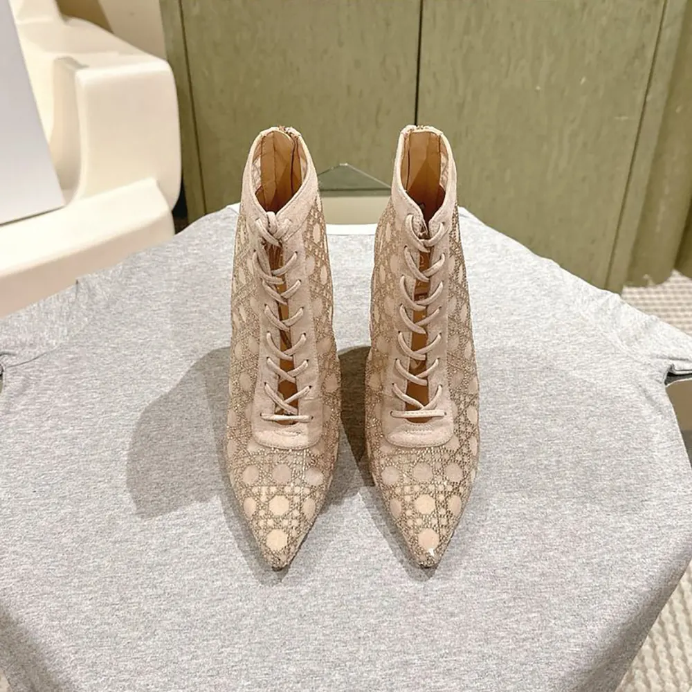 Close-up of beige mesh and silver Dior signature on ankle boot
