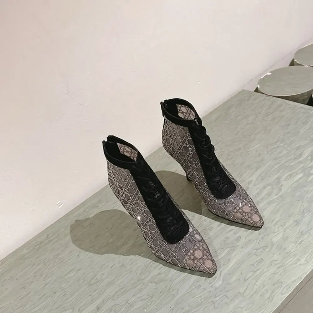 Close-up of silver ‘D’ logo hardware on Dior Women Naughtily-D Boot