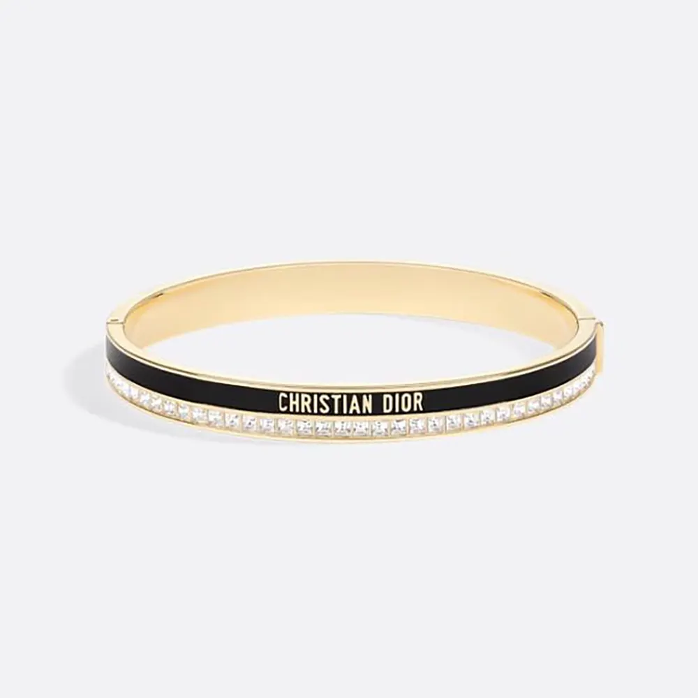 Close-up of Dior Women Night Code Bangle gold-finish metal and crystals
