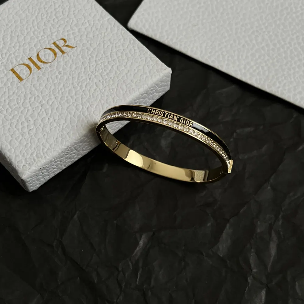 Side angle showing black lacquer detail on Dior Women Night Code Bangle