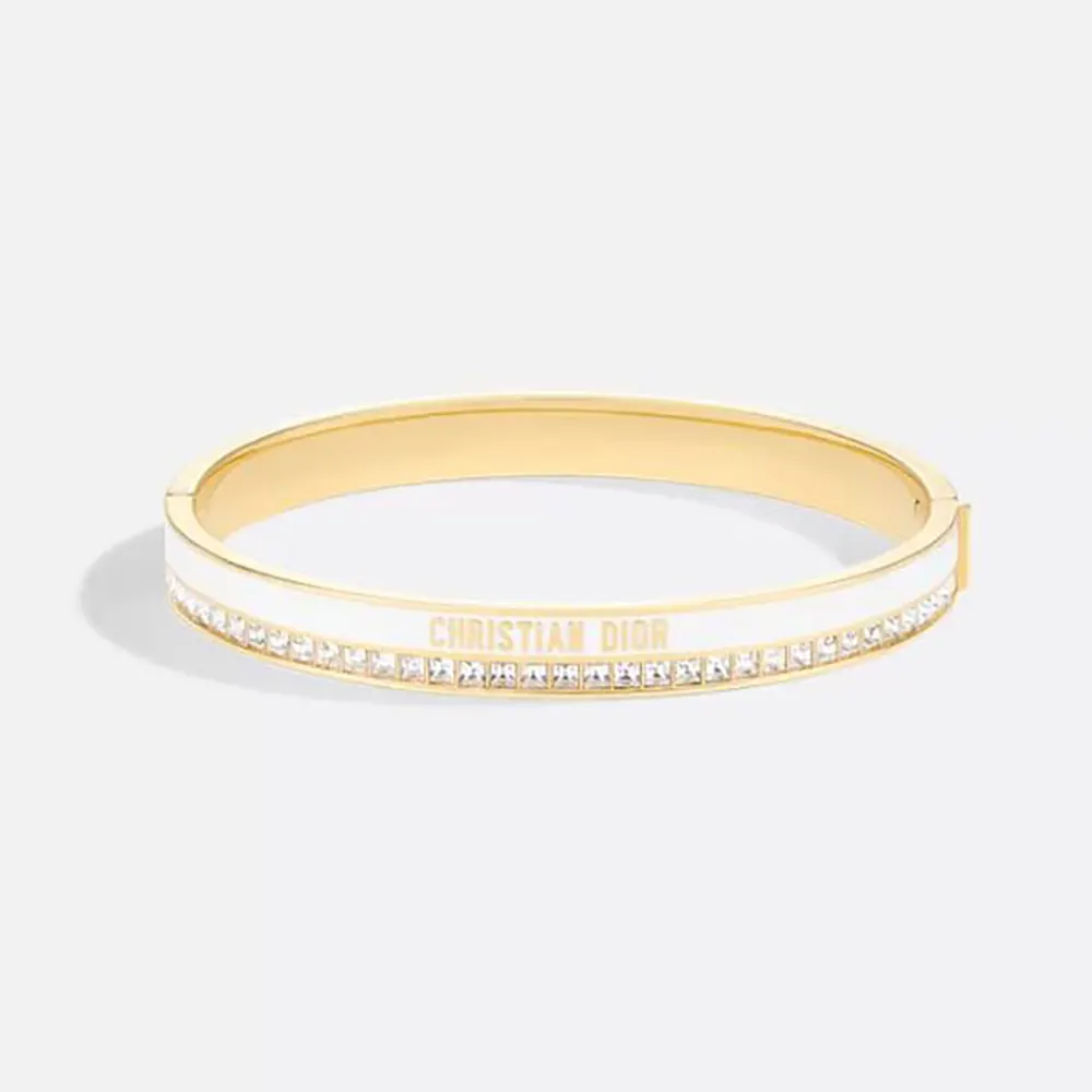 Close-up of Dior Women Night Code Bangle gold-finish metal and crystals