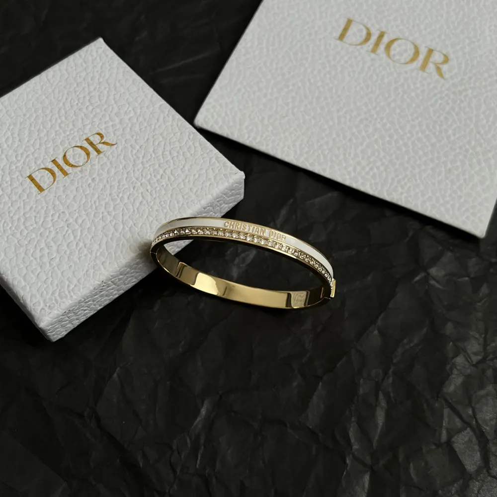 Side angle showing white lacquer detail on Dior Women Night Code Bangle