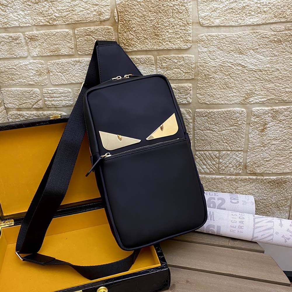 Side angle showing adjustable strap on Fendi Men Monster Sling Bag