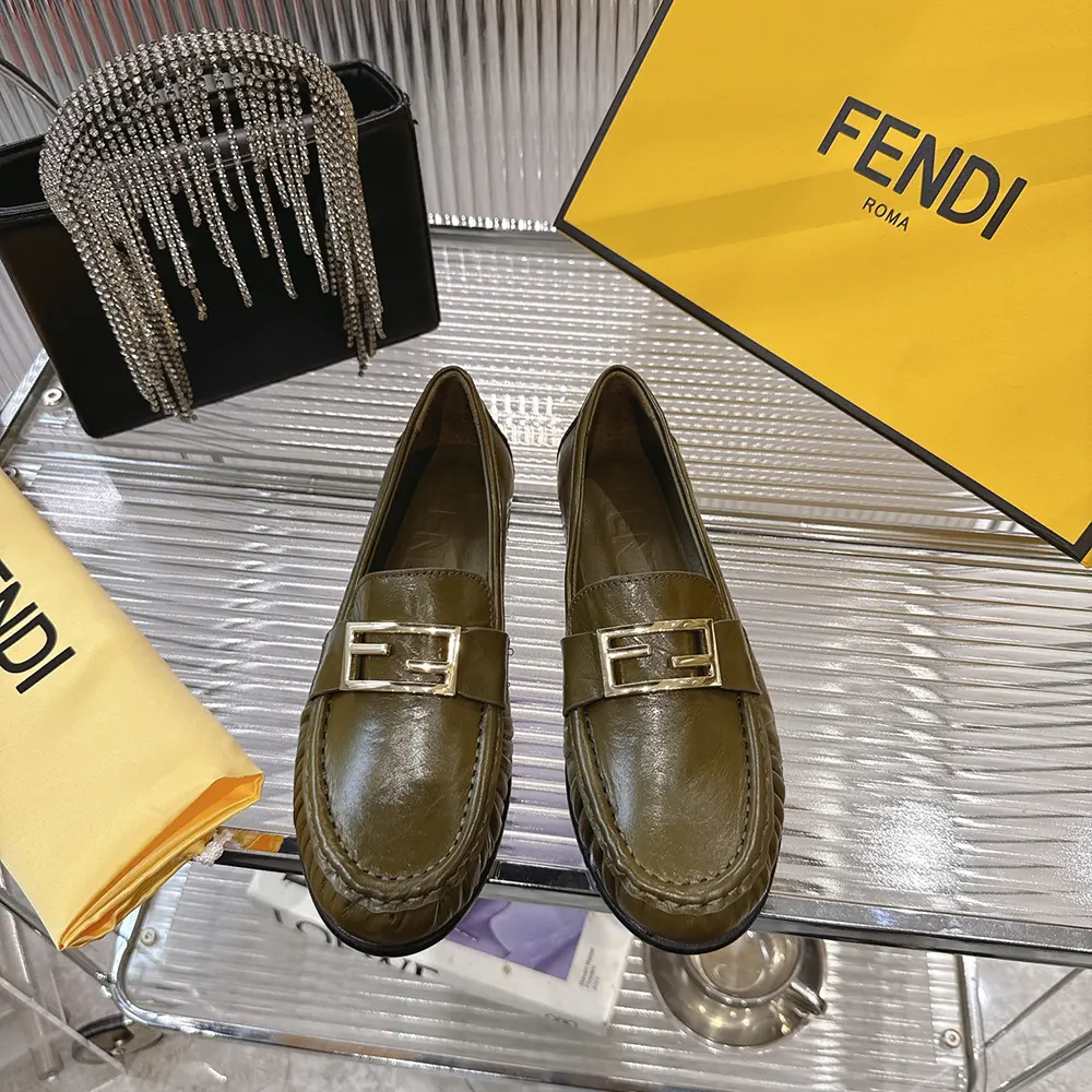 Close-up on gold-tone baguette hardware on Fendi Women Baguette Green Nappa Leather Loafers