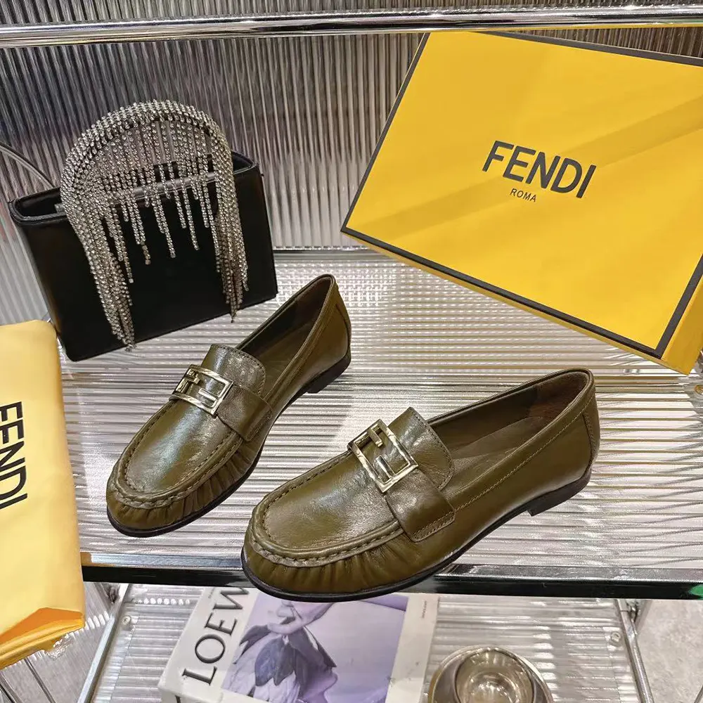 Top angle highlighting supple green nappa leather on Fendi Women Baguette Loafers