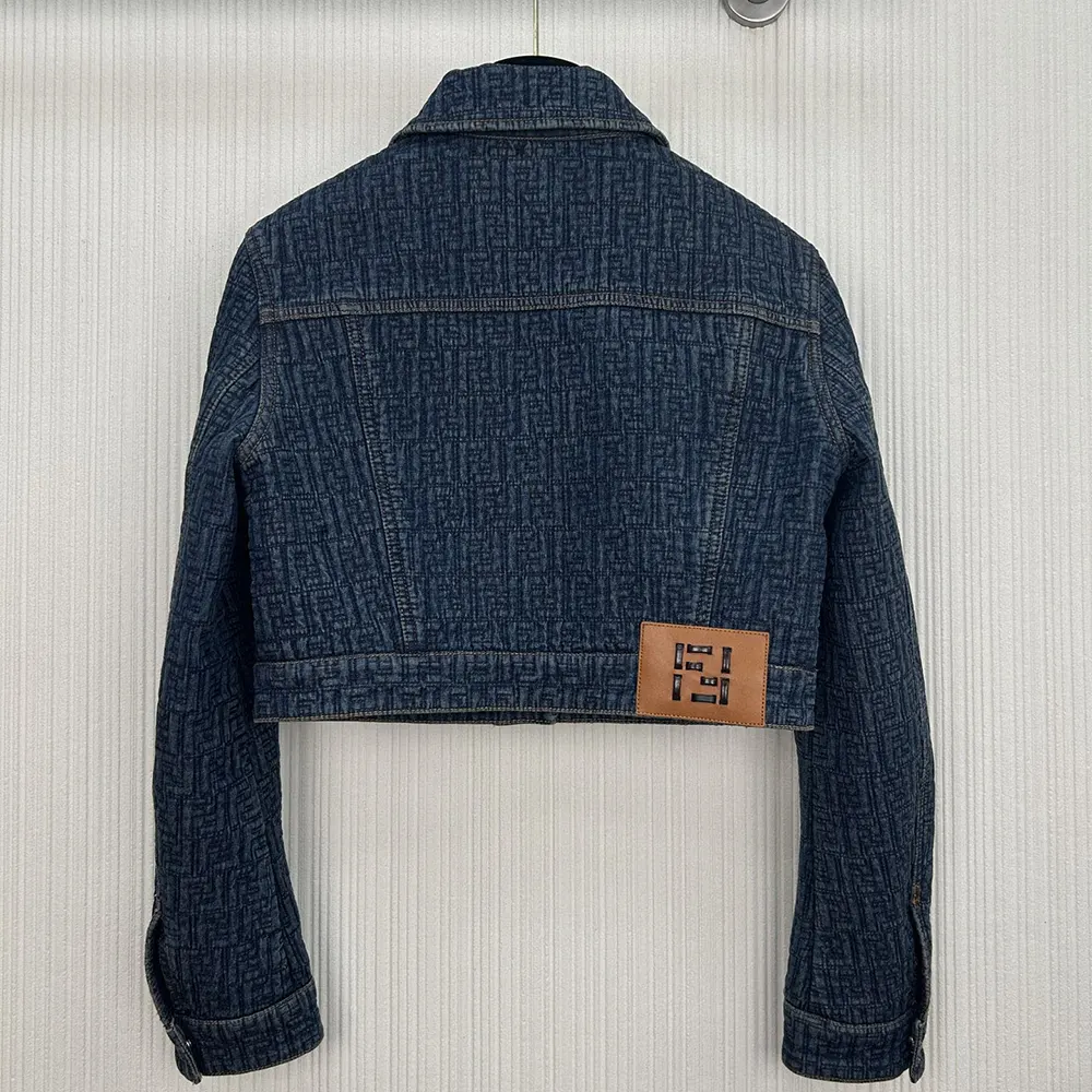Side profile of Fendi Women Dark Blue FF Denim Jacket with button closure visible