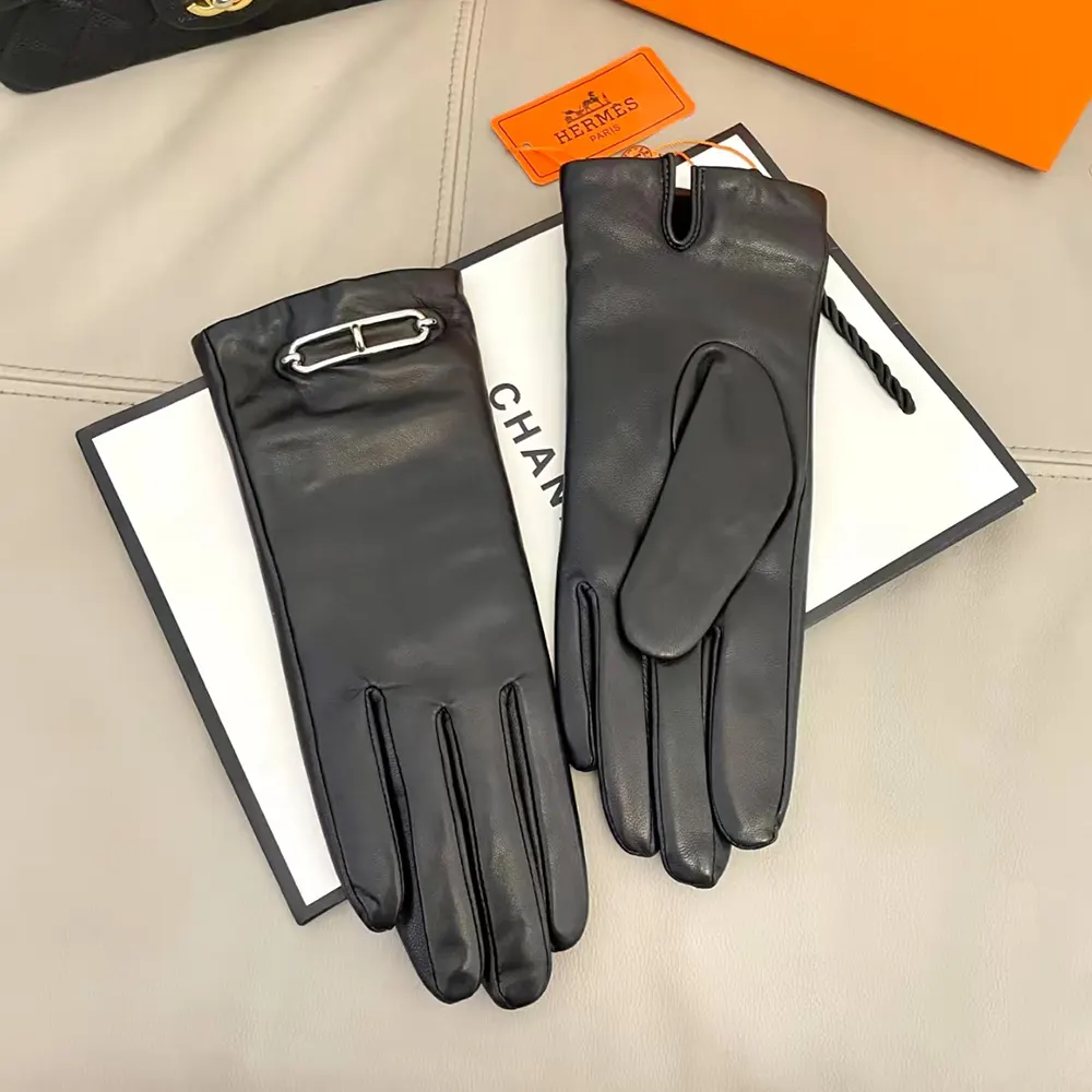 Close-up of Hermes Women Gloves in Lambskin Leather-Black wrist logo detail
